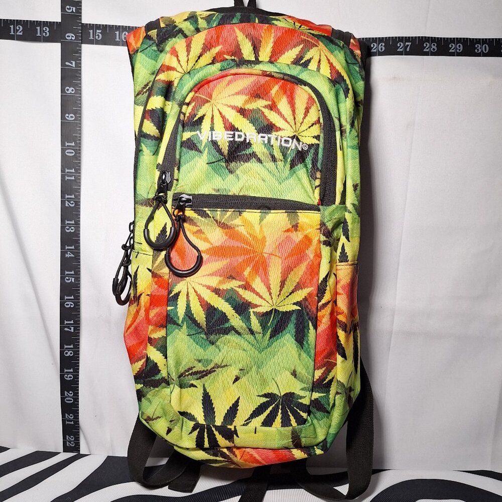 Vibedration Hydration Backpack w/o bladder - green, orange, black leaves - used